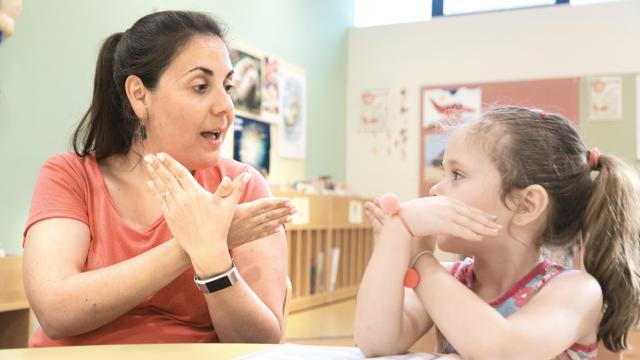 Deaf SEND learner using sign language